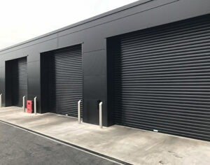 Three black steel roller shutter doors